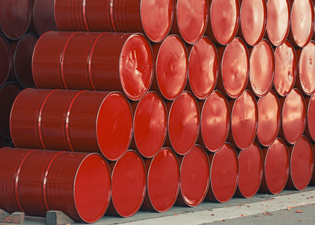 Red oil barrels stacked on top of each other.